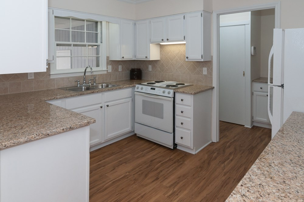 1445 Princess Anne Road Raleigh, NC 27607 - Photo 4 of 25 Fresh paint and hardware update the kitchen, as well as the granite and backsplash. Off the kitchen find a large pantry and additional work area (great place to stash a laptop!), more storage! Kitchen
