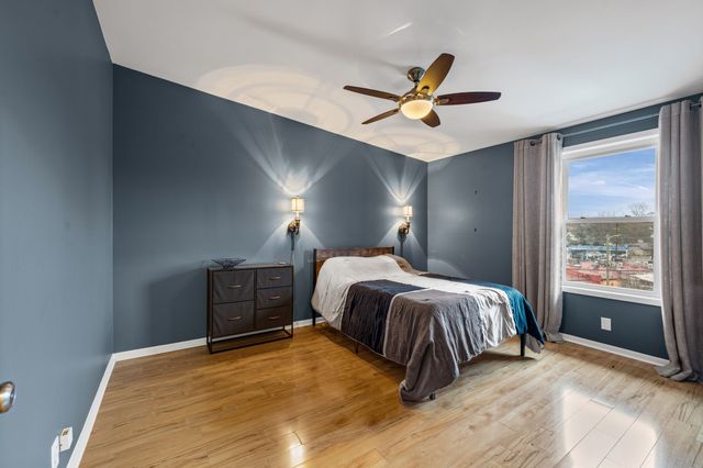 a view of a building with a snow on the road