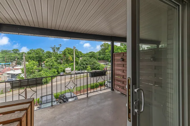 a view of a balcony with lake view and a potted plant