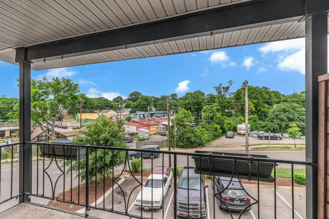 a view of a porch with wooden floor