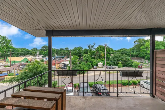 an aerial view of a house with swimming pool and garden