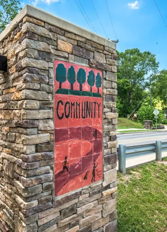 a front view of a building with potted plants
