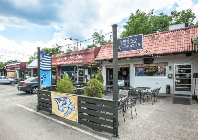 a front view of building with yard