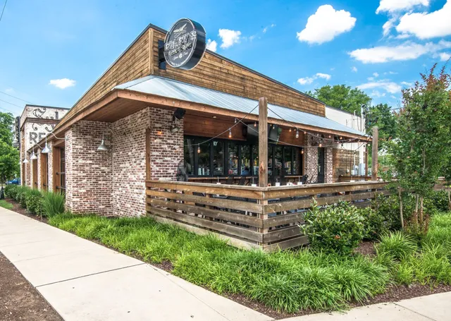 a front view of a building with seating space