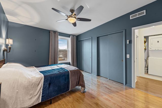 a bedroom with bed and window