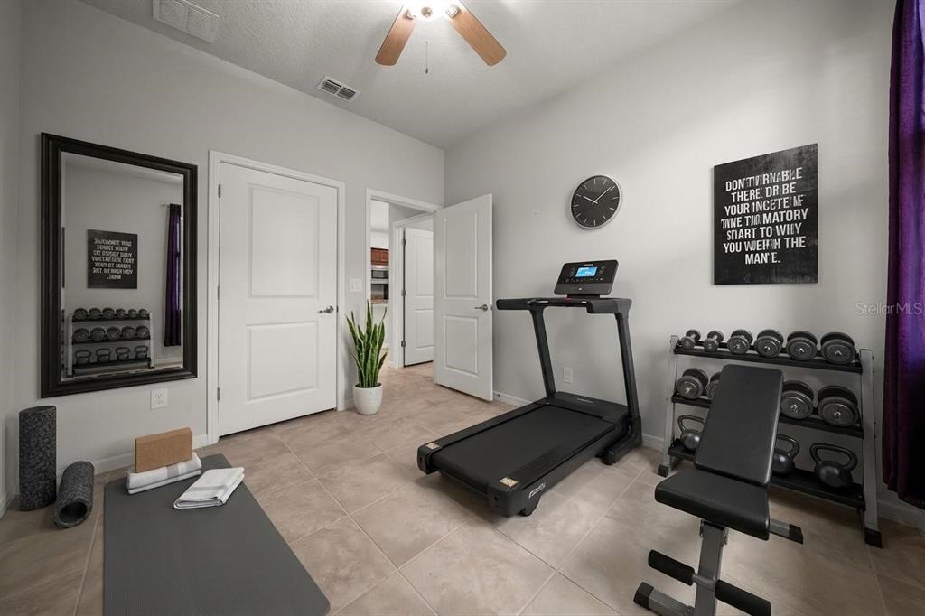 5947 Southwest 93rd Circle Ocala, FL 34481 - Photo 16 of 32 a room with gym equipment