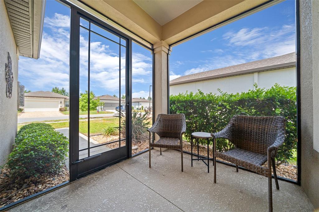 5947 Southwest 93rd Circle Ocala, FL 34481 - Photo 5 of 32 a outdoor living space with furniture and garden view
