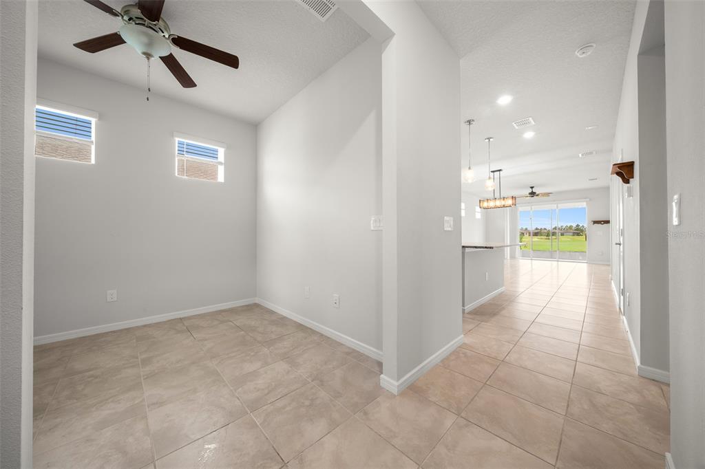 5947 Southwest 93rd Circle Ocala, FL 34481 - Photo 7 of 32 a view of an empty room and a kitchen