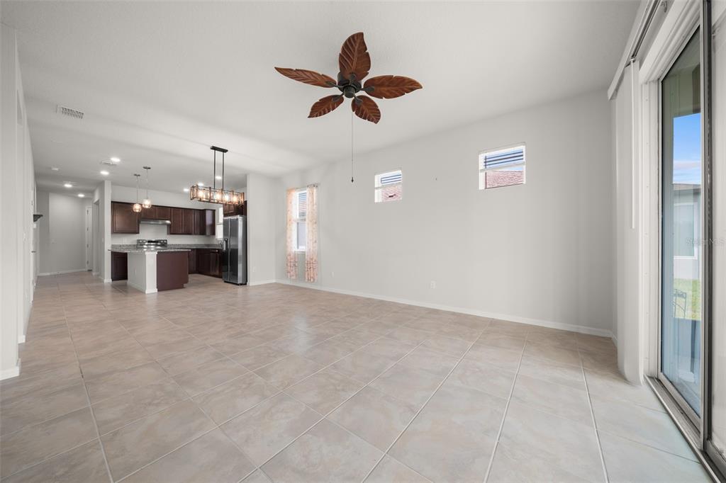 5947 Southwest 93rd Circle Ocala, FL 34481 - Photo 9 of 32 a view of a kitchen with a sink and a refrigerator