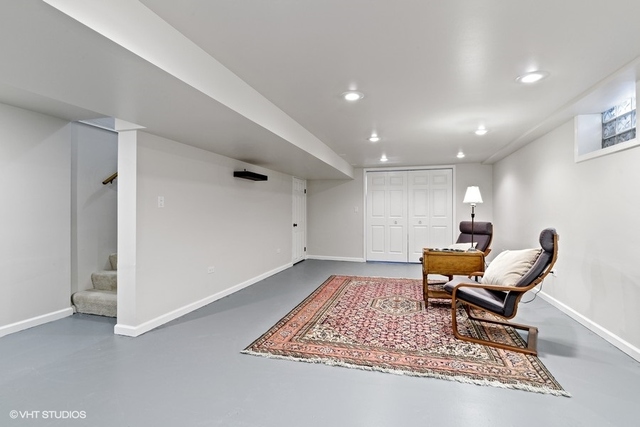 455 Elmhurst Road Mount Prospect, IL 60056 - Photo 15 of 19 a living room with furniture and a rug