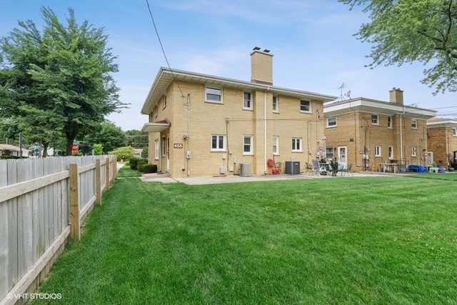 455 Elmhurst Road Mount Prospect, IL 60056 - Photo 17 of 19 a view of a house with backyard and garden