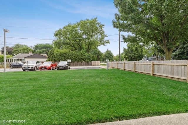 455 Elmhurst Road Mount Prospect, IL 60056 - Photo 18 of 19 a view of yard with grass and trees