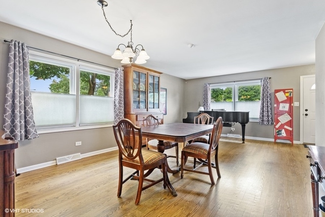 455 Elmhurst Road Mount Prospect, IL 60056 - Photo 4 of 19 a view of a dining room with furniture window and outside view