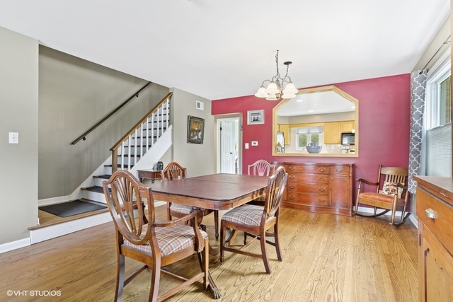 455 Elmhurst Road Mount Prospect, IL 60056 - Photo 5 of 19 a view of a dining room with furniture and wooden floor