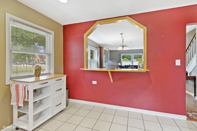 455 Elmhurst Road Mount Prospect, IL 60056 - Photo 8 of 19 a workspace with kitchen island