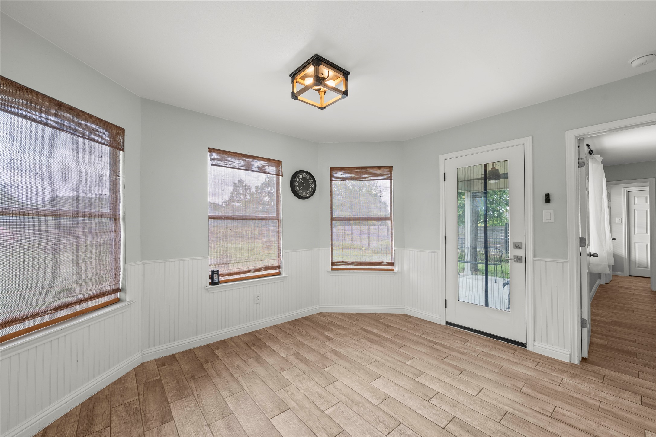 1329 Quail Ravine Round Rock, TX 78664 - Photo 14 of 39 Gleaming wood-look tile floors and classic wainscoting define this inviting entry space.