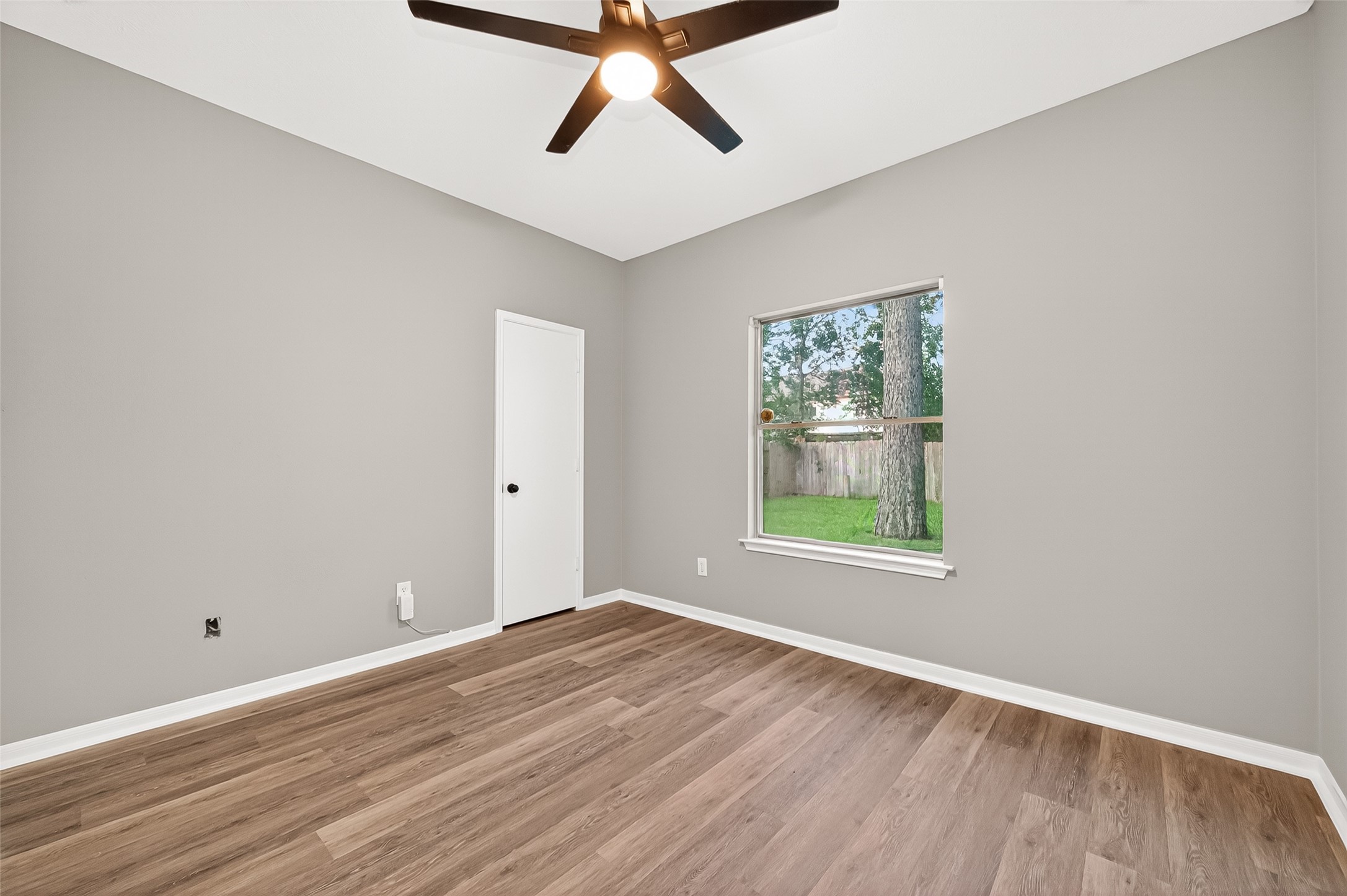 23810 Spring Way Drive Spring, TX 77373 - Photo 30 of 35 wooden floor in an empty room with a window
