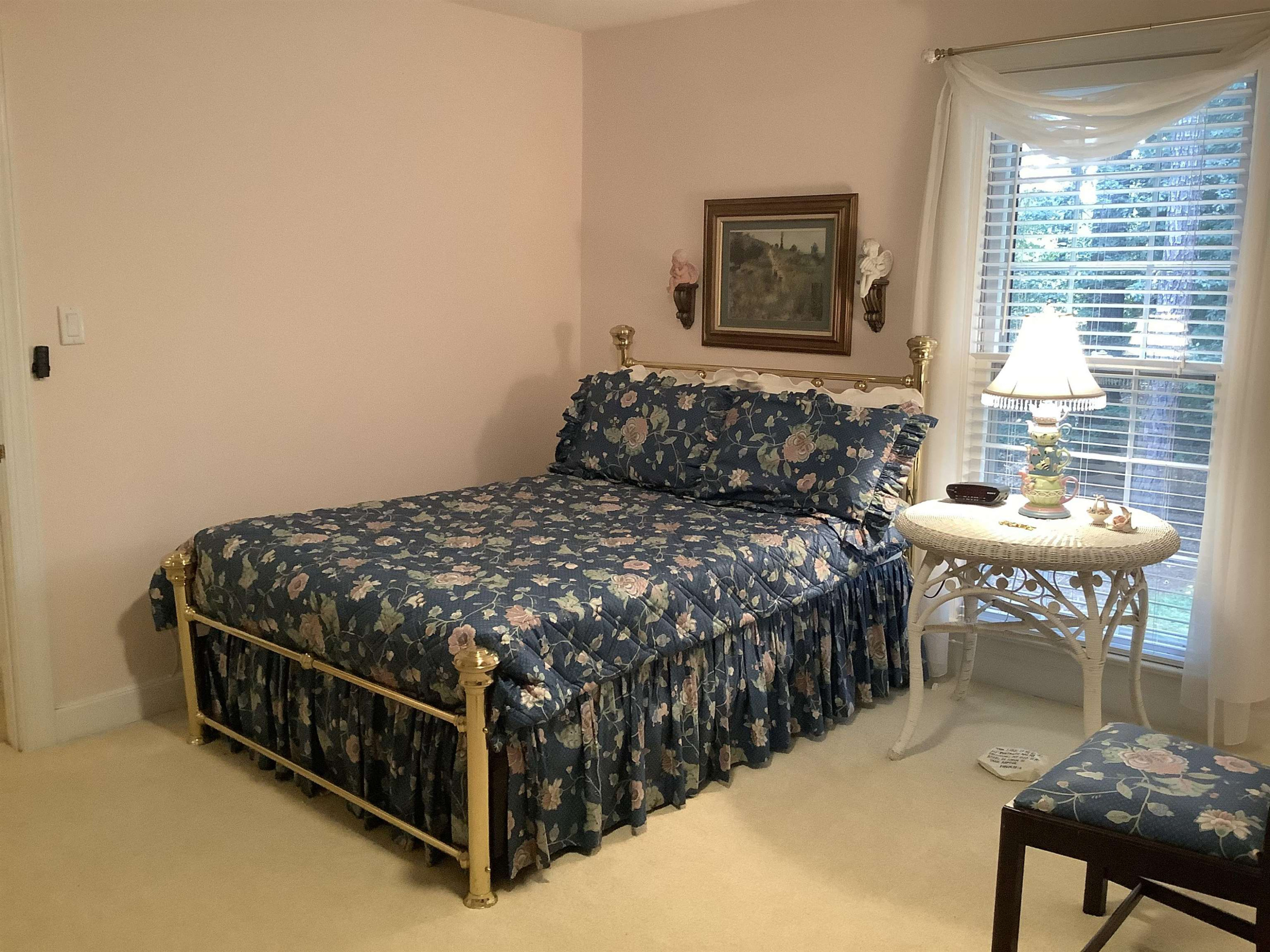 3 Gathering Place Raleigh, NC 27604 - Photo 54 of 57 a bed sitting in a bedroom next to a window