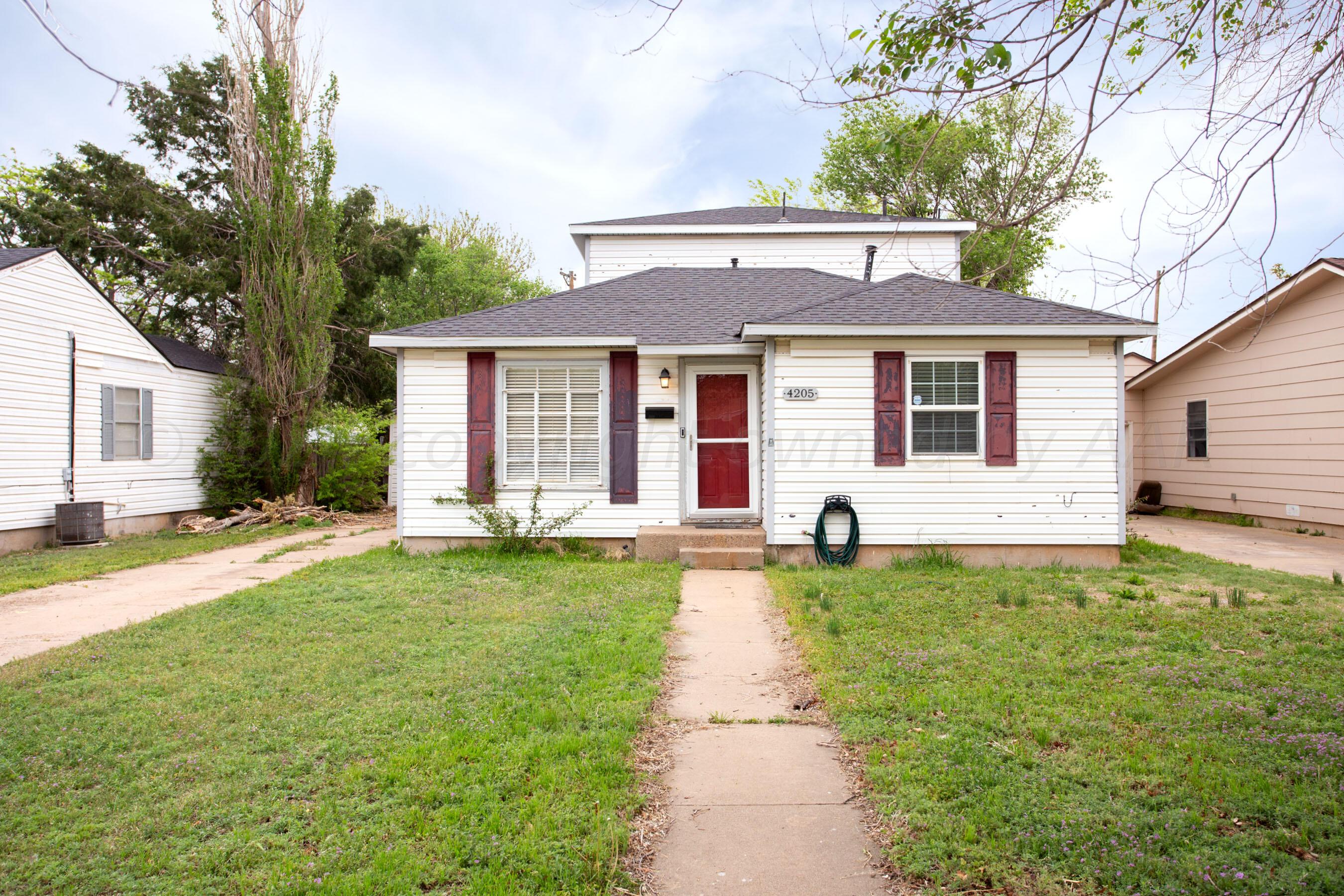 4205 South Ong Street Amarillo, TX 79110 - Photo 2 of 25 a front view of a house with yard