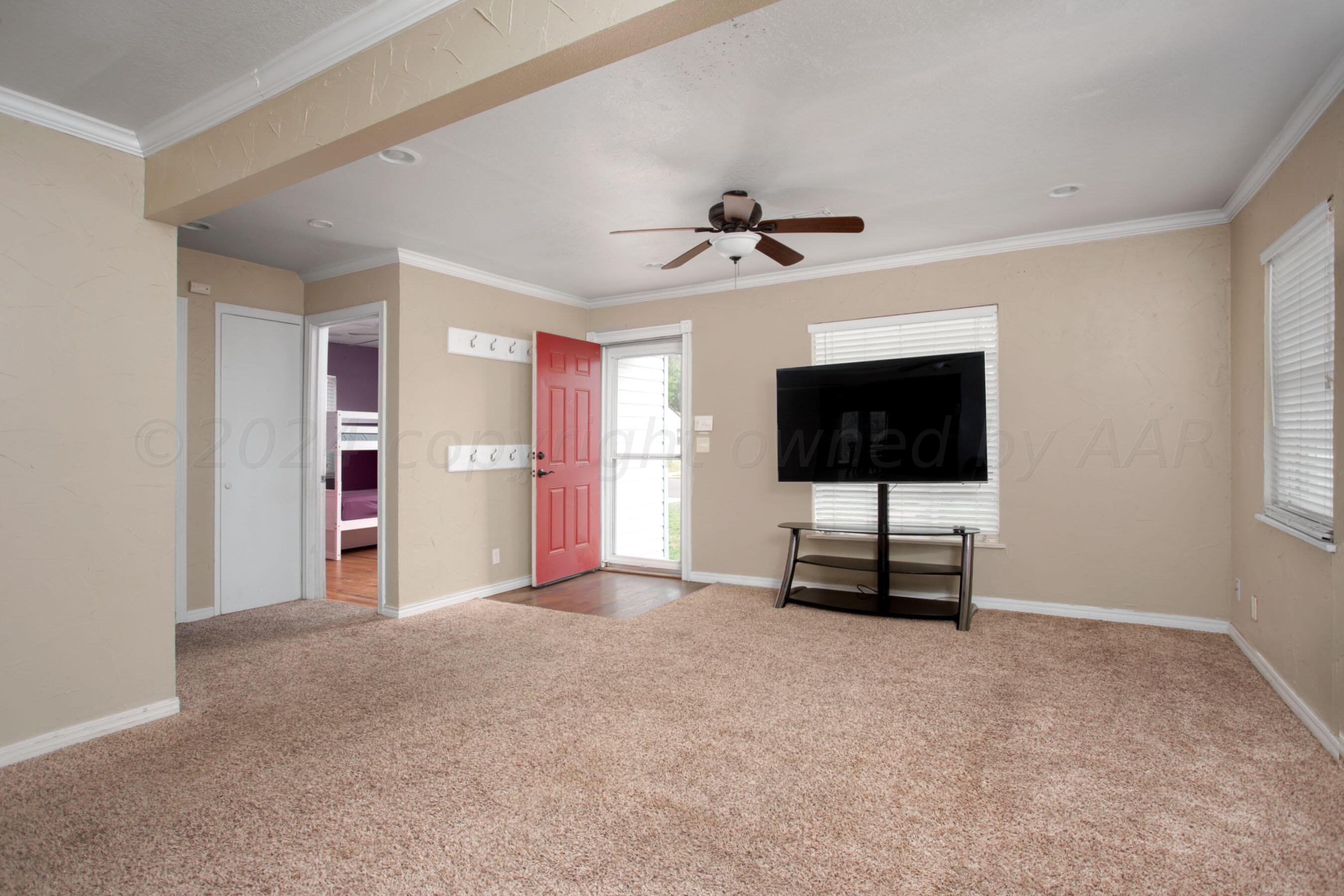 4205 South Ong Street Amarillo, TX 79110 - Photo 5 of 25 a view of an empty room with a window