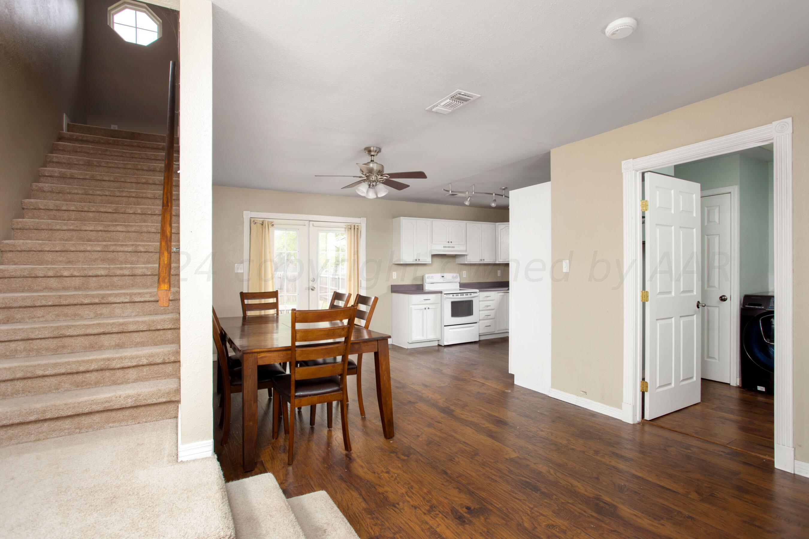 4205 South Ong Street Amarillo, TX 79110 - Photo 8 of 25 a view of a dining room with furniture and wooden floor