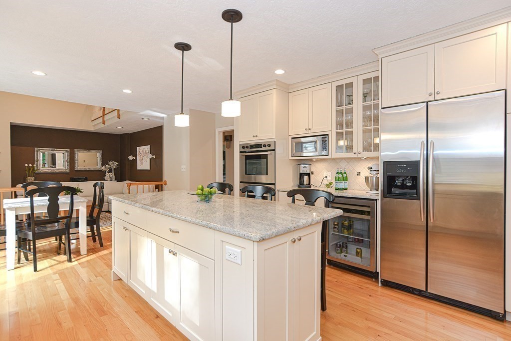 75 Alpine Drive Holliston, MA 01746 - Photo 12 of 42 a kitchen with stainless steel appliances granite countertop a sink a stove and a refrigerator