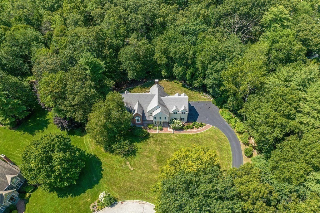 75 Alpine Drive Holliston, MA 01746 - Photo 2 of 42 a view of a garden with a fountain