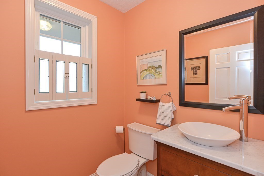 75 Alpine Drive Holliston, MA 01746 - Photo 23 of 42 a bathroom with a toilet a sink and a mirror