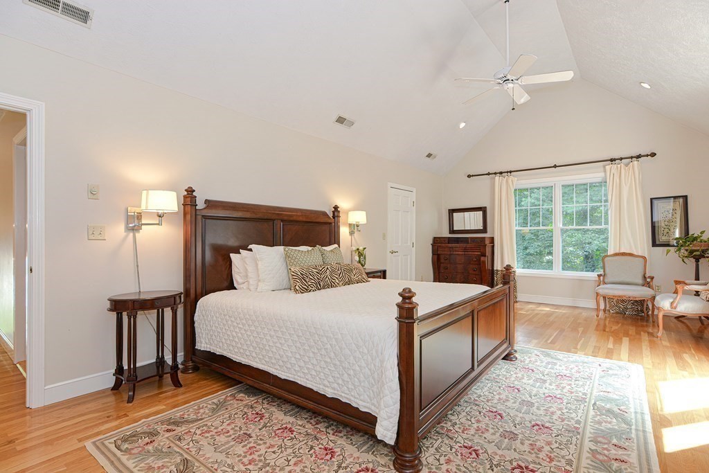 75 Alpine Drive Holliston, MA 01746 - Photo 25 of 42 a large bedroom with a bed a table and chairs