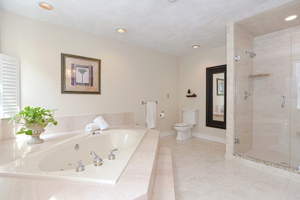 75 Alpine Drive Holliston, MA 01746 - Photo 29 of 42 a white bath tub sitting next to a white toilet