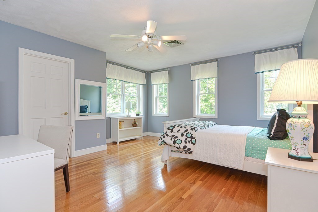 75 Alpine Drive Holliston, MA 01746 - Photo 30 of 42 a bedroom with a bed windows and wooden floor