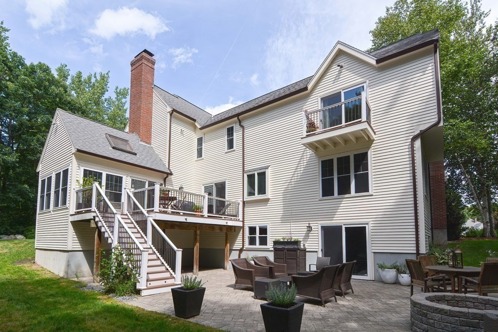 75 Alpine Drive Holliston, MA 01746 - Photo 7 of 42 a front view of a house with garden