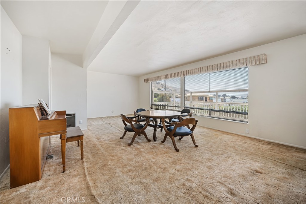 2275 Cass Avenue Cayucos, CA 93430 - Photo 21 of 60 a living room with furniture and a window