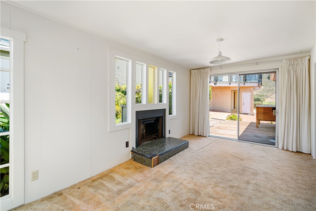 2275 Cass Avenue Cayucos, CA 93430 - Photo 24 of 60 a living room with furniture and a fireplace