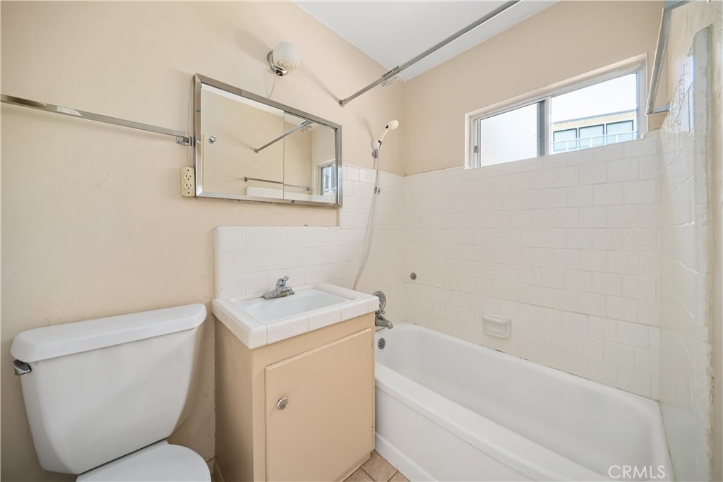 2275 Cass Avenue Cayucos, CA 93430 - Photo 30 of 60 a bathroom with a toilet sink and mirror
