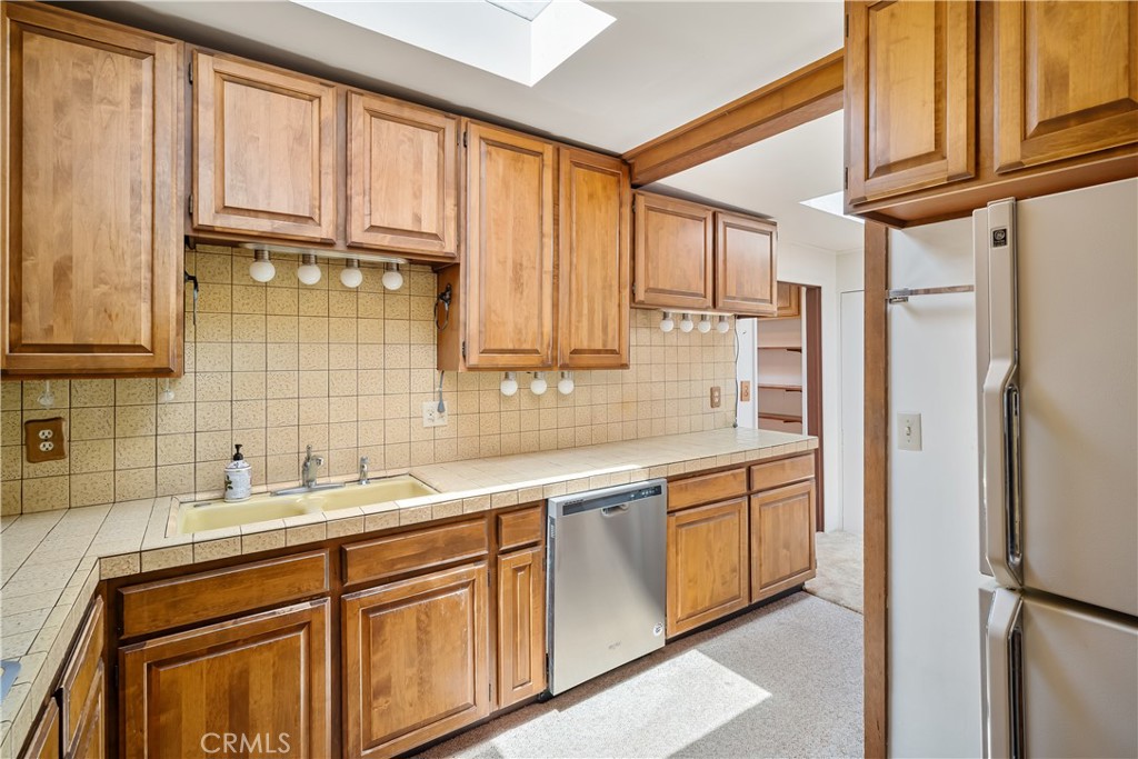 2275 Cass Avenue Cayucos, CA 93430 - Photo 34 of 60 a kitchen with stainless steel appliances granite countertop a sink and cabinets