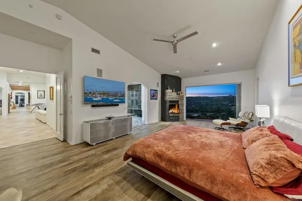 a large kitchen with stainless steel appliances table chairs and a large window