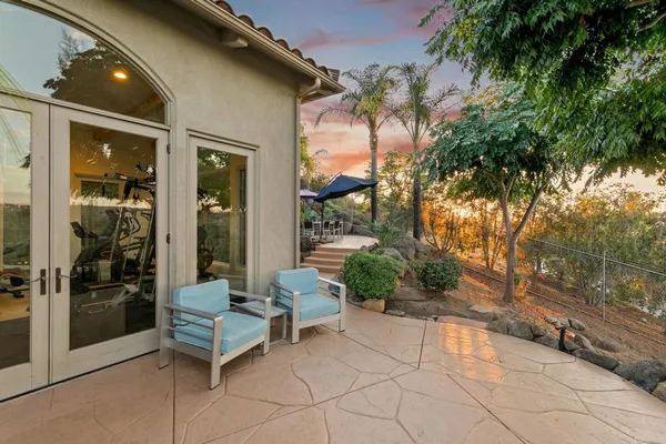 an aerial view of residential houses with outdoor space and mountain view