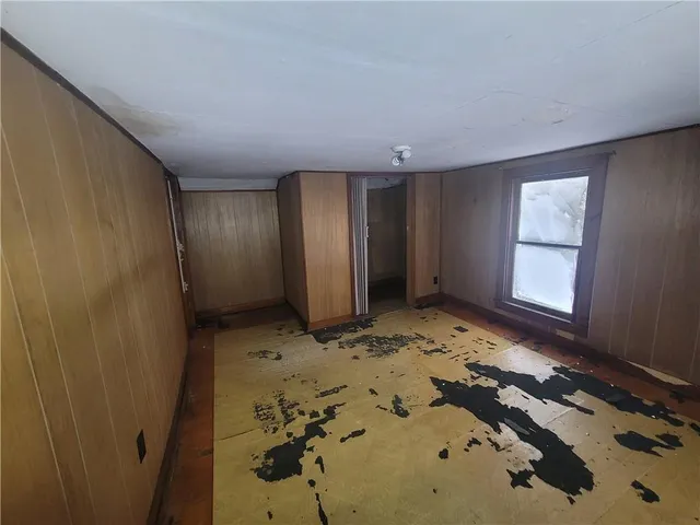 a view of a closet area with painted walls