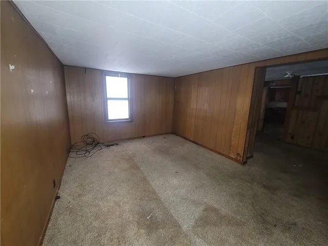 an empty room with closet area