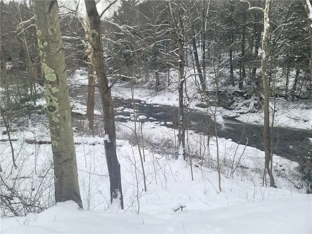 a view of a covered with snow in the backyard