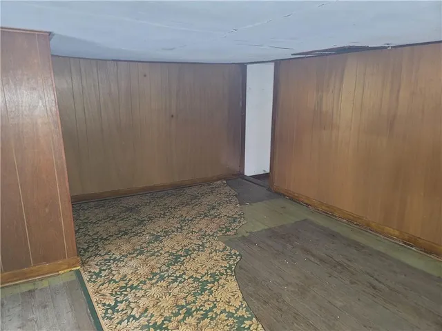 an empty room with a wooden door