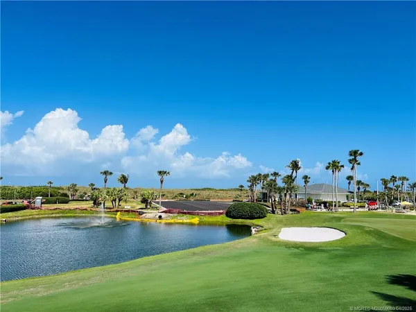 a view of a swimming pool with a yard