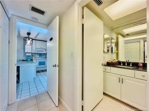 a kitchen with stainless steel appliances a refrigerator and cabinets