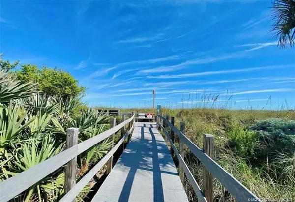 a view of a balcony with mountain view and wooden floor