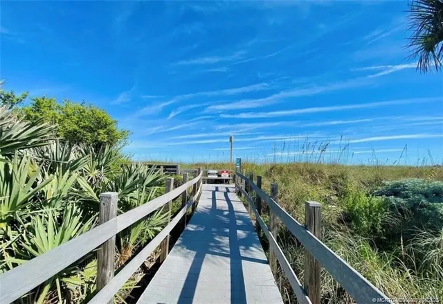 a view of a balcony with mountain view and wooden floor