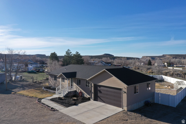 2095 West 4100 North Spring Glen, UT 84526 - Photo 33 of 35 Ranch-style house with concrete driveway and an attached garage