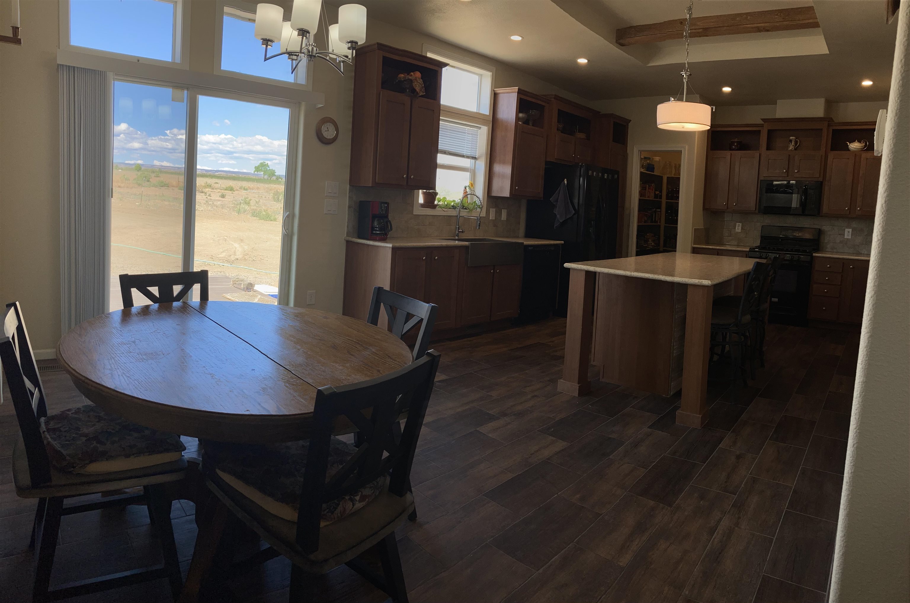 2413 1300th Road Delta, CO 81416 - Photo 11 of 35 a view of a dining room with furniture and window