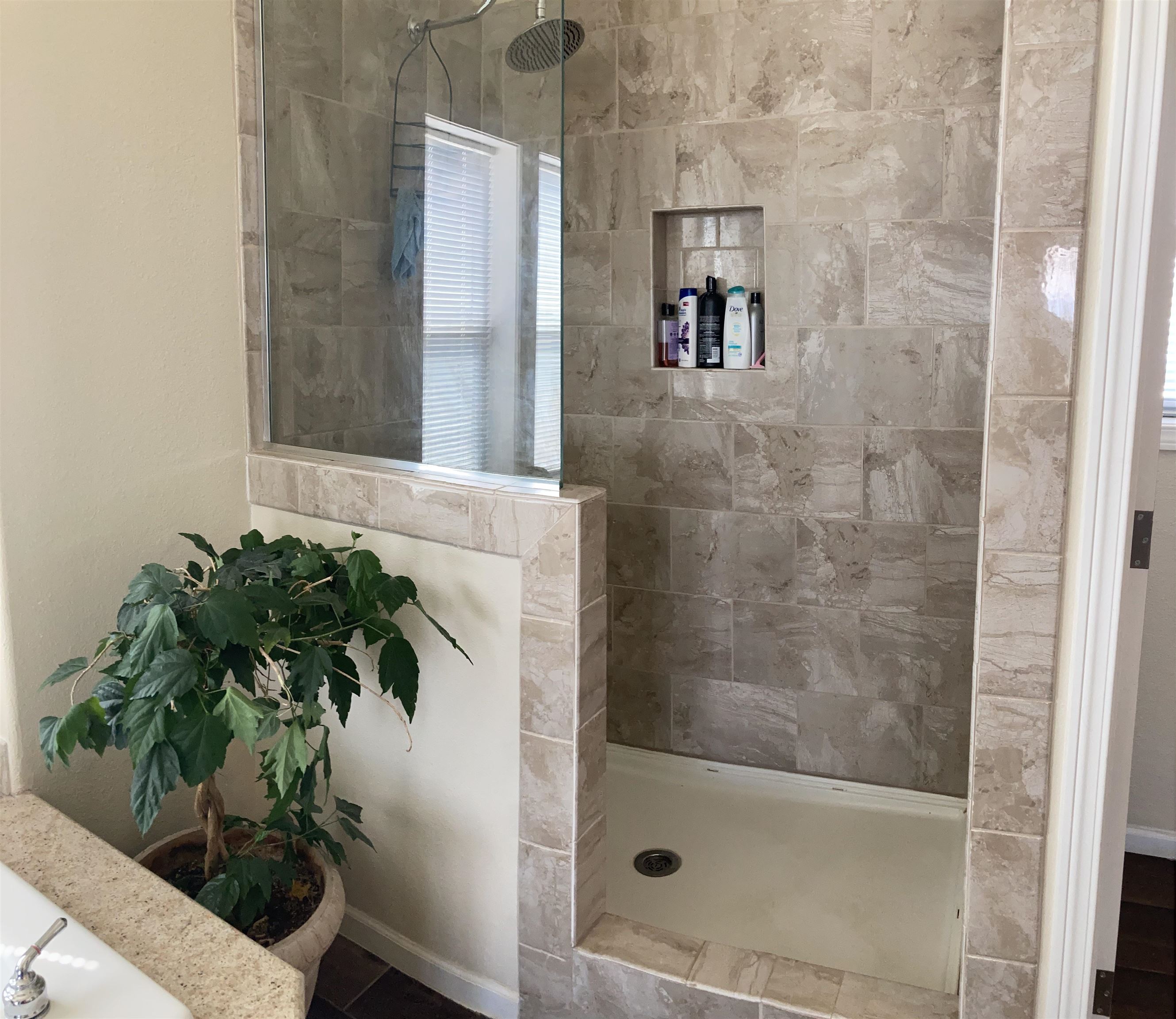 2413 1300th Road Delta, CO 81416 - Photo 18 of 35 a bathroom with a shower and a mirror