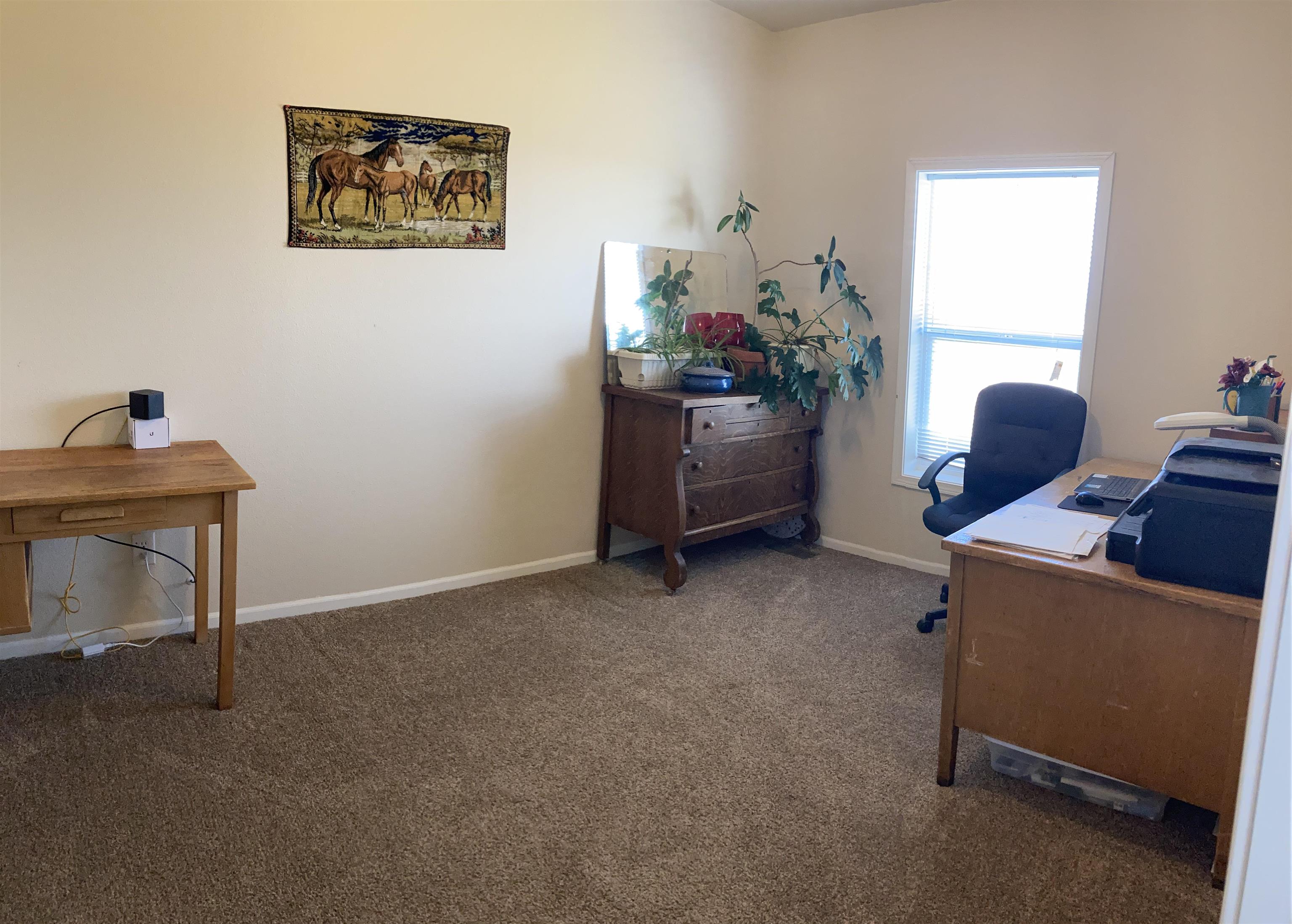 2413 1300th Road Delta, CO 81416 - Photo 20 of 35 a room with furniture and a window